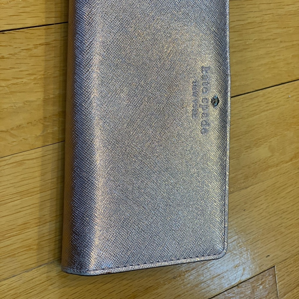 Kate Spade rose gold folded wallet.